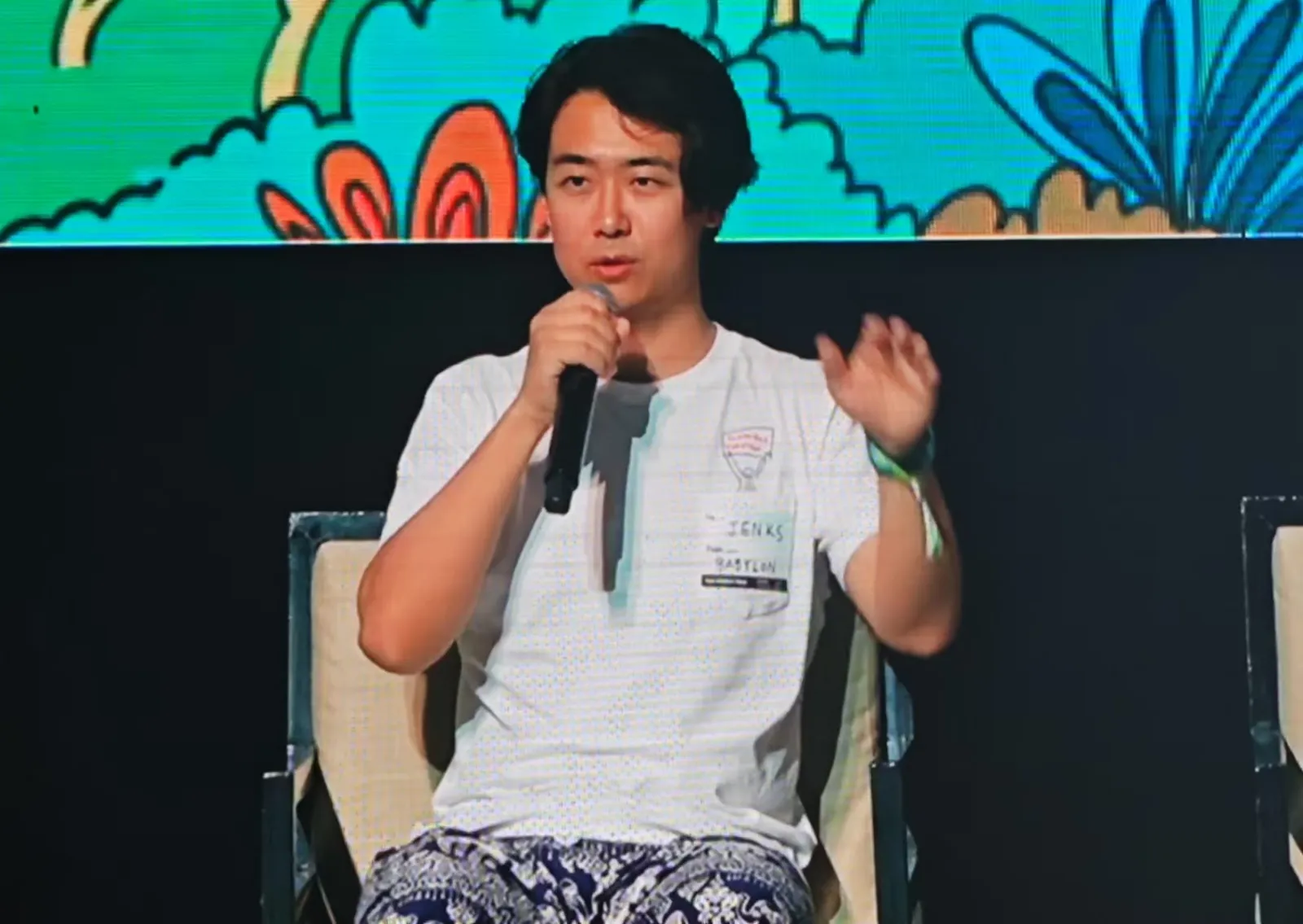 Jenks speaking on a conference panel